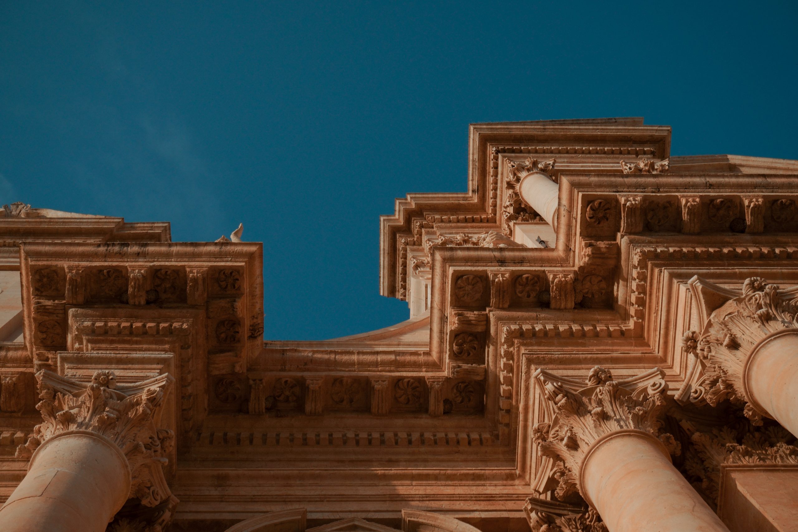 Low angle view historic building against clear sky scaled